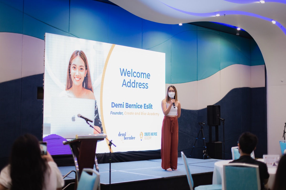 Demi giving the welcome address at a Create & Rise Academy event